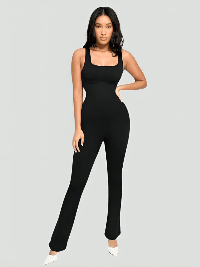 Flared shapewear jumpsuit romper with shaping seamless curve-enhancing design. Square neck, low back, fitted style in black, Outerwear shapewear, shapewear outerwear, Waist cinching, Waist snatching, snatched, Hidden shapwear, built-in shapewear, shapewear technology, stretchy, compression, arm slimming, tummy control, body contouring, best shapewear for women, shapewear on sale, Canadian shapewear brand, skims, spanx, popilush, shapermint. Feelin girl.
