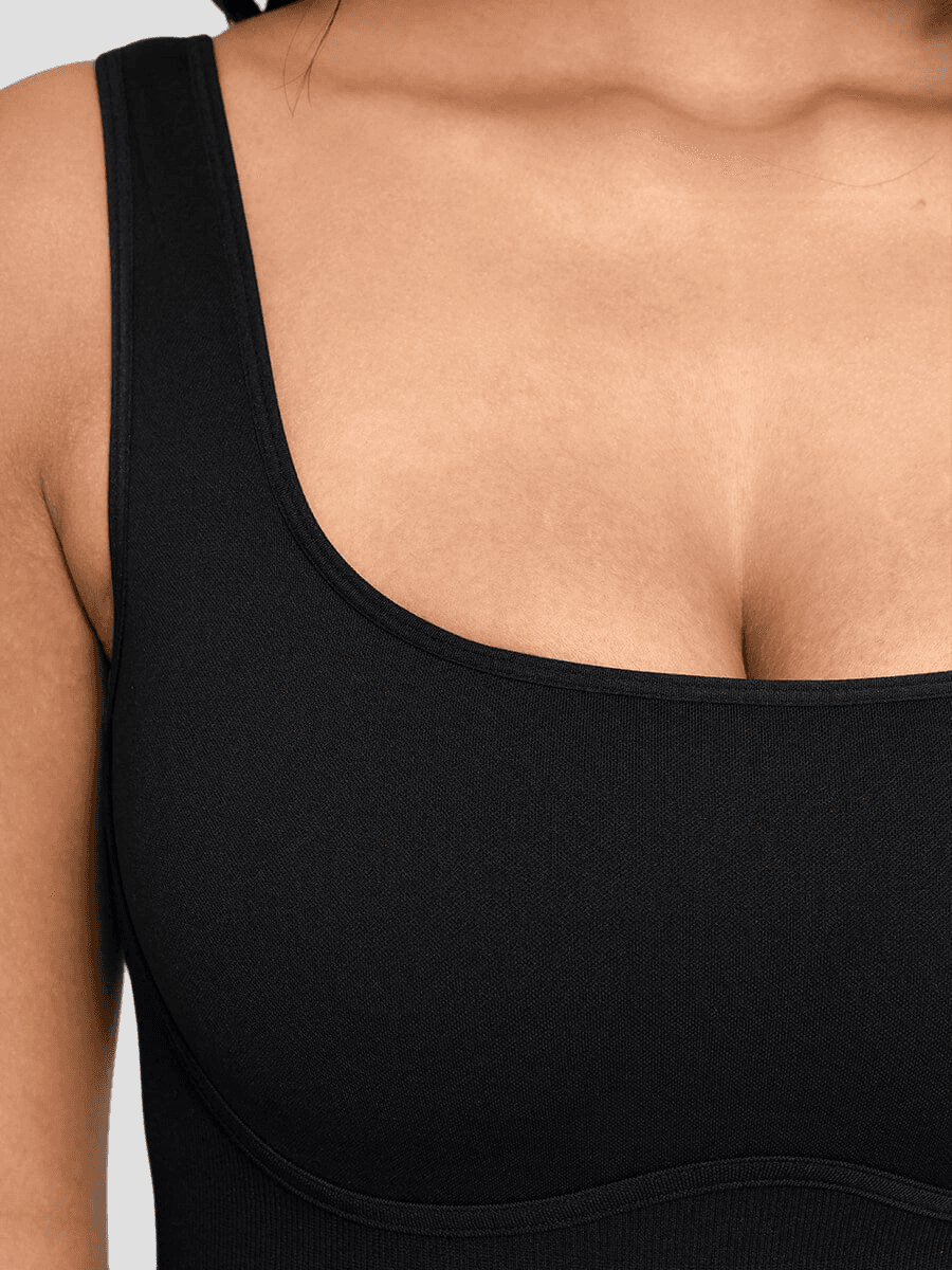 Flared shapewear jumpsuit romper with shaping seamless curve-enhancing design. Square neck, low back, fitted style in black, Outerwear shapewear, shapewear outerwear, Waist cinching, Waist snatching, snatched, Hidden shapwear, built-in shapewear, shapewear technology, stretchy, compression, arm slimming, tummy control, body contouring, best shapewear for women, shapewear on sale, Canadian shapewear brand, skims, spanx, popilush, shapermint. Feelin girl.