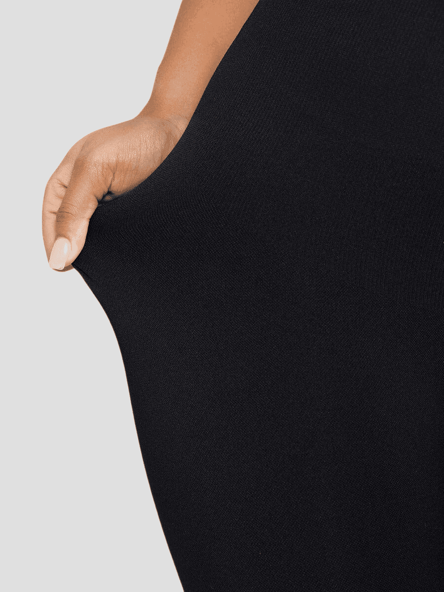 Flared shapewear jumpsuit romper with shaping seamless curve-enhancing design. Square neck, low back, fitted style in black, Outerwear shapewear, shapewear outerwear, Waist cinching, Waist snatching, snatched, Hidden shapwear, built-in shapewear, shapewear technology, stretchy, compression, arm slimming, tummy control, body contouring, best shapewear for women, shapewear on sale, Canadian shapewear brand, skims, spanx, popilush, shapermint. Feelin girl.