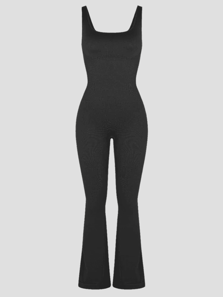 Flared shapewear jumpsuit romper with shaping seamless curve-enhancing design. Square neck, low back, fitted style in black, Outerwear shapewear, shapewear outerwear, Waist cinching, Waist snatching, snatched, Hidden shapwear, built-in shapewear, shapewear technology, stretchy, compression, arm slimming, tummy control, body contouring, best shapewear for women, shapewear on sale, Canadian shapewear brand, skims, spanx, popilush, shapermint. Feelin girl.