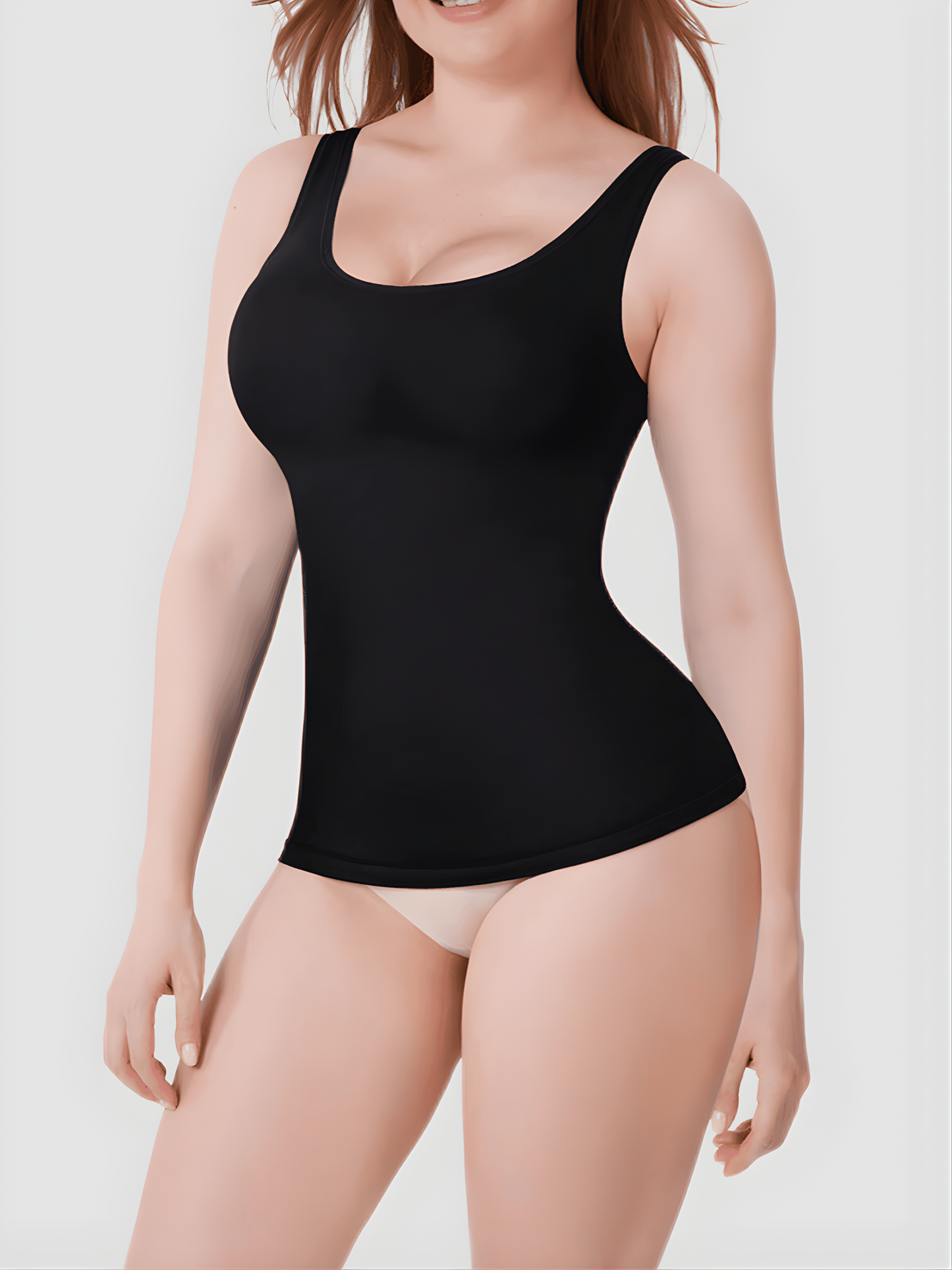 Woman wearing a black shaping tank top by BodyFlexx Shapewear and beige underwear showing off her curves.