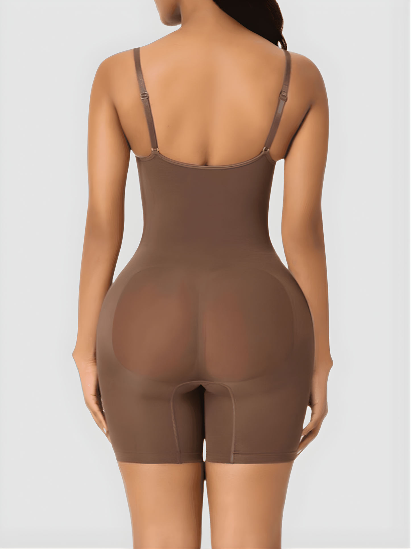 Woman wearing a brown bodysuit shaping garment designed by BodyFlexx Shapewear