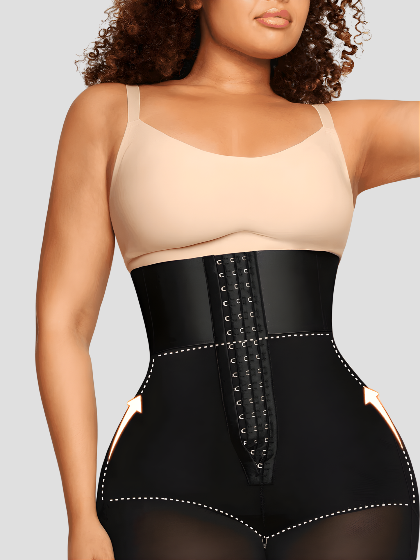 Woman wearing a black Columbian Faja Corset Waist Trainer Shaper by BodyFlexx Shapewear with beige top.