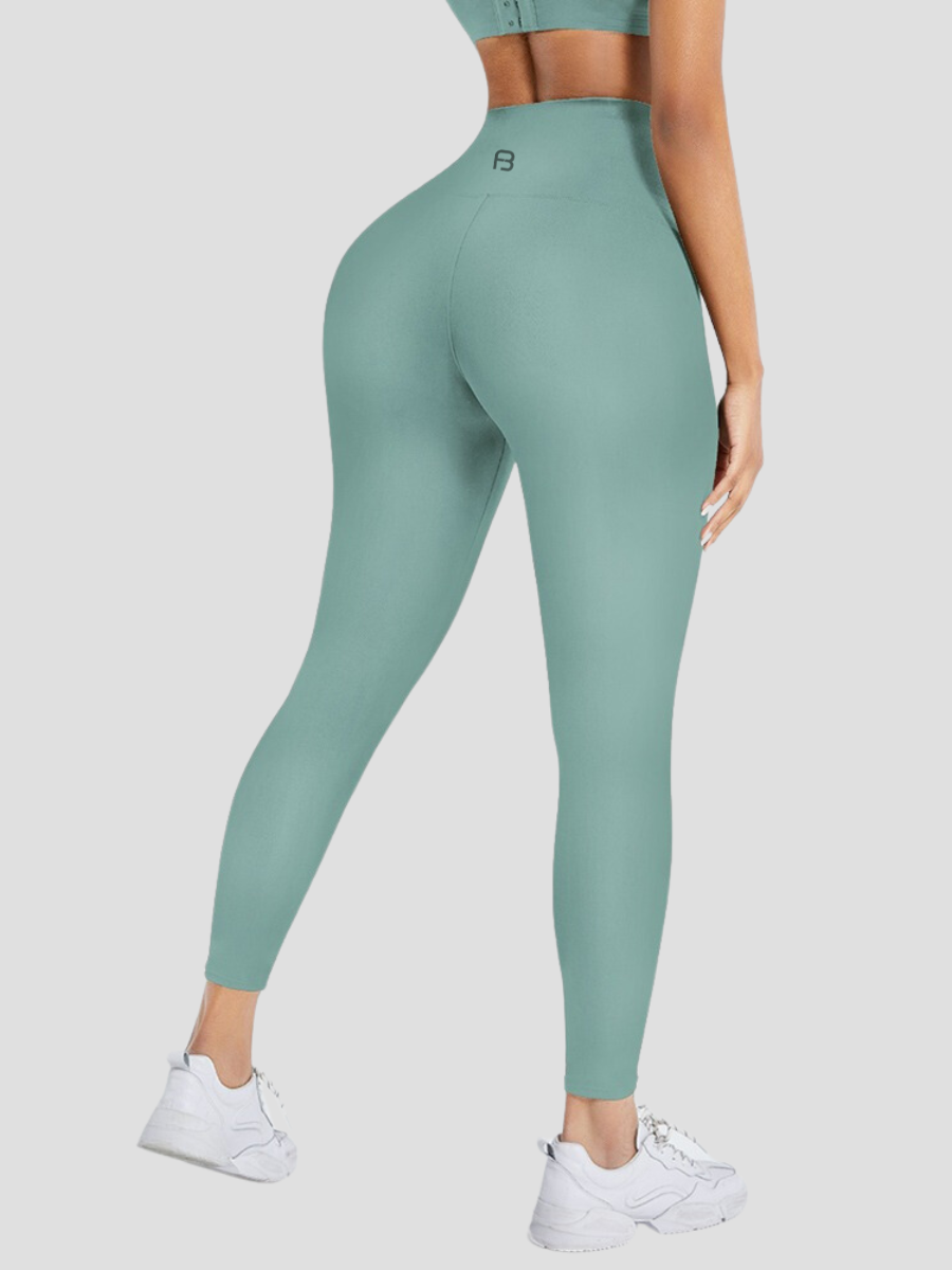 Waist Training Leggings, teal, Turquoise, Corset Leggings, Activewear, booty-boosting, booty lifting, bum lifting, workout clothes for women, sweat-wicking, high compression, cellulite smoothing, waist cinching, BBL, seamless, squat proof, plus size gym outfits, high waisted, breathable, nike, under armour, adidas, puma, champion, bombshell activewear, gymshark women, Girlfriend Collective, lululemon, Alo Yoga, Bandier, Athleta, Athletica, Fabletics.