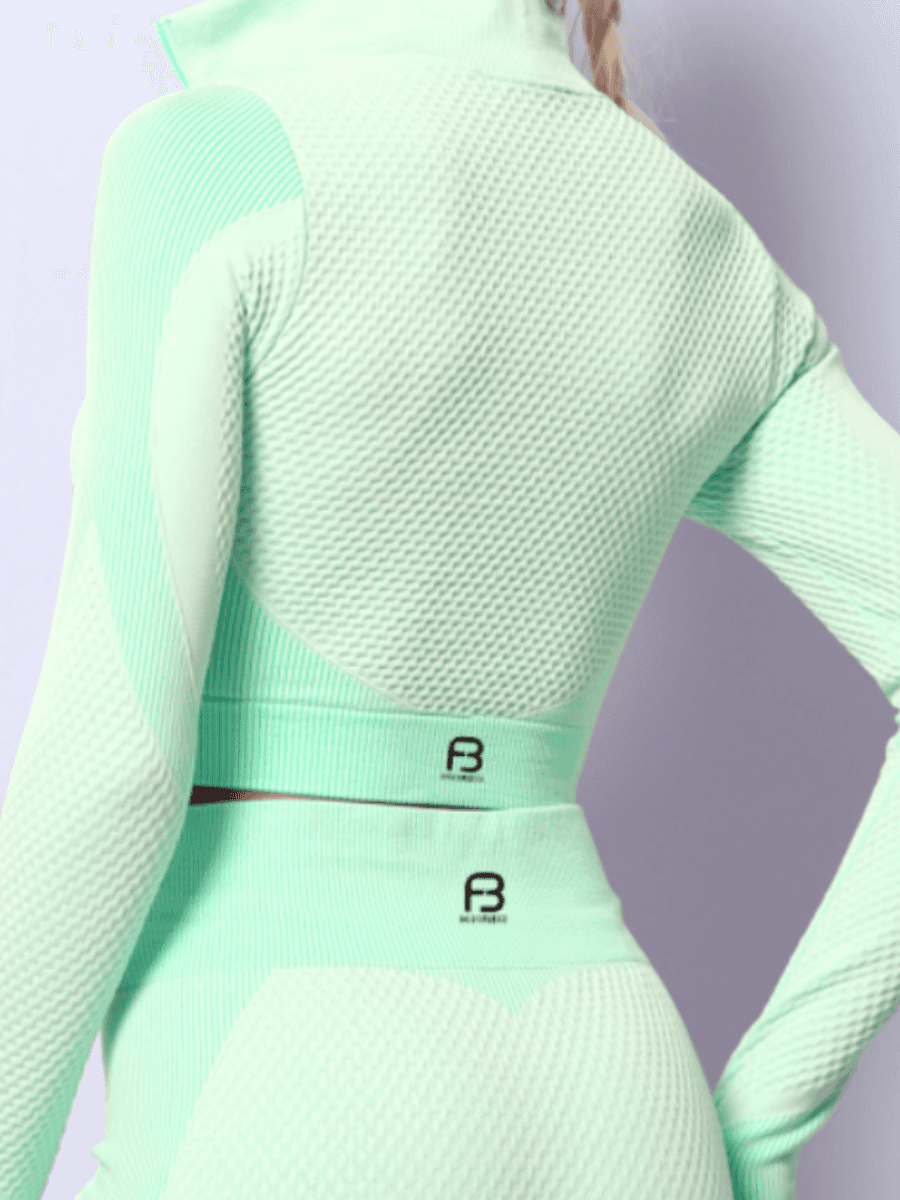 Cropped athletic set top with zipper stretchy jacket, workout outfit, athleisure, activewear, activewear sets, workout clothes for women, sweat-wicking, high compression, cellulite smoothing, BBL Jacket, plus size gym outfits, workout wear, gym wear, athletic outfits, nike, under armour, adidas, puma, champion, bombshell activewear, gymshark women, Girlfriend Collective, lululemon, Alo Yoga, Bandier, Athleta, Athletica, Fabletics, Revenge body, Teal Blue, Green.