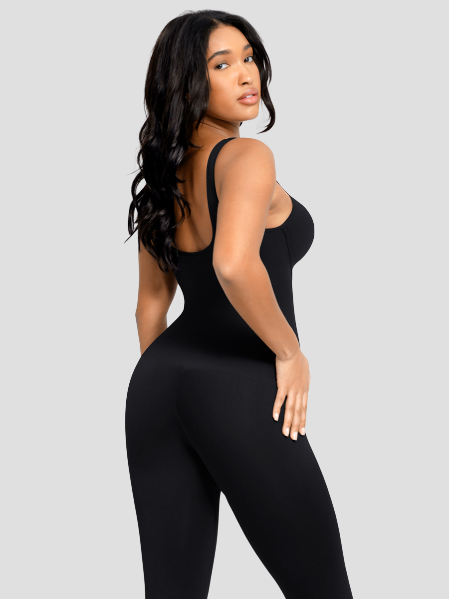 Flared shapewear jumpsuit romper with shaping seamless curve-enhancing design. Square neck, low back, fitted style in black, Outerwear shapewear, shapewear outerwear, Waist cinching, Waist snatching, snatched, Hidden shapwear, built-in shapewear, shapewear technology, stretchy, compression, arm slimming, tummy control, body contouring, best shapewear for women, shapewear on sale, Canadian shapewear brand, skims, spanx, popilush, shapermint. Feelin girl.