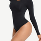 Woman wearing a black long-sleeve bodysuit with built-in shapewear by BodyFlexx.
