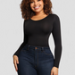 Woman posing wearing a black long-sleeve sculpting bodysuit by BodyFlexx Shapewear with blue jeans.