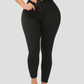 Woman wearing black waist training leggings with a corset closure designed for tummy-control and cellulite-smoothing by BodyFlexx Shapewear.