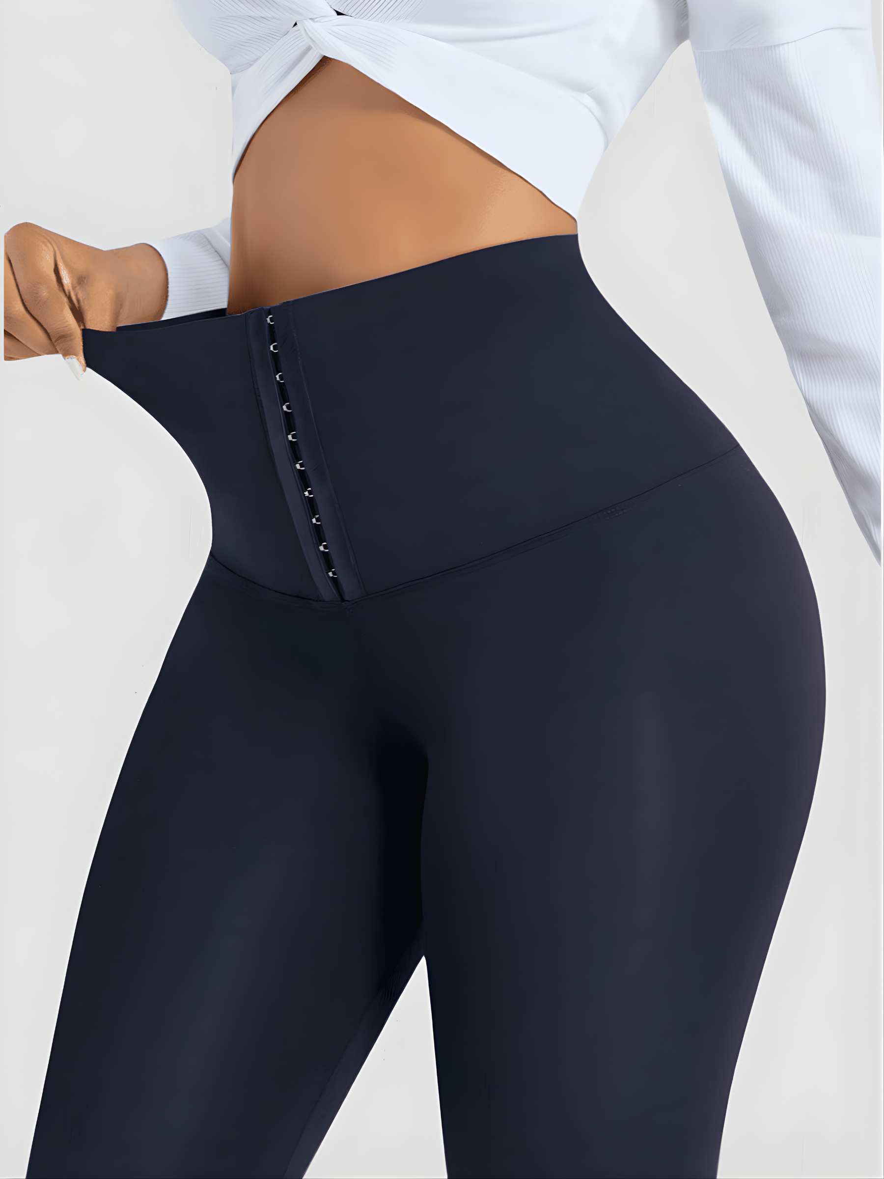 Woman wearing blue high waisted corset leggings for tummy-control and cellulite-smoothing by BodyFlexx Shapewear.