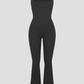 Black shaping jumpsuit romper with built-in shapewear and a flared leg design.