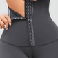 Woman wearing high-waisted gray waist-training leggings with a 3-level  corset-style closure to flatten her tummy and sculpt her curves.