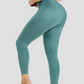 Woman posing wearing high waisted teal blue waist training leggings with a 3 row hook-and-eye corset closure by BodyFlexx Shapewear.