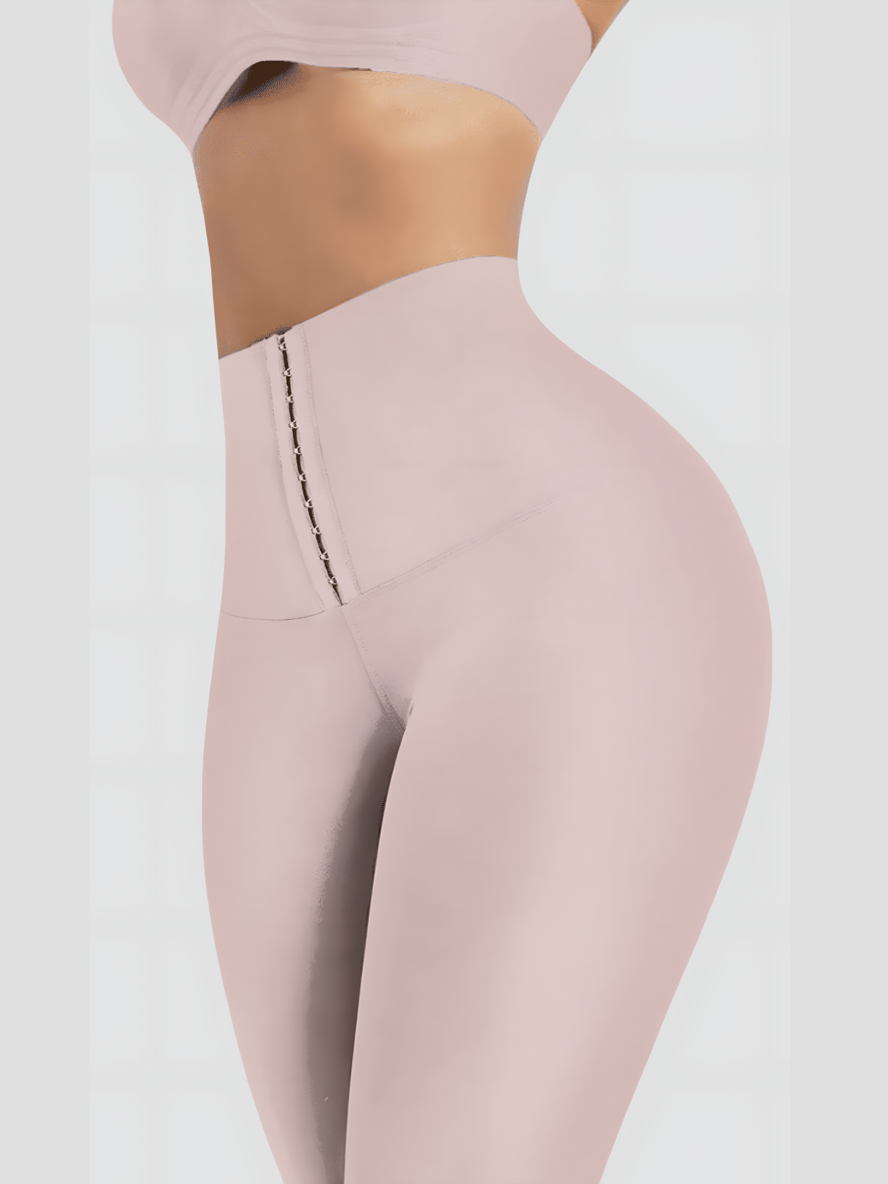 Woman wearing light pink high waisted corset leggings for tummy-control and cellulite-smoothing by BodyFlexx Shapewear.