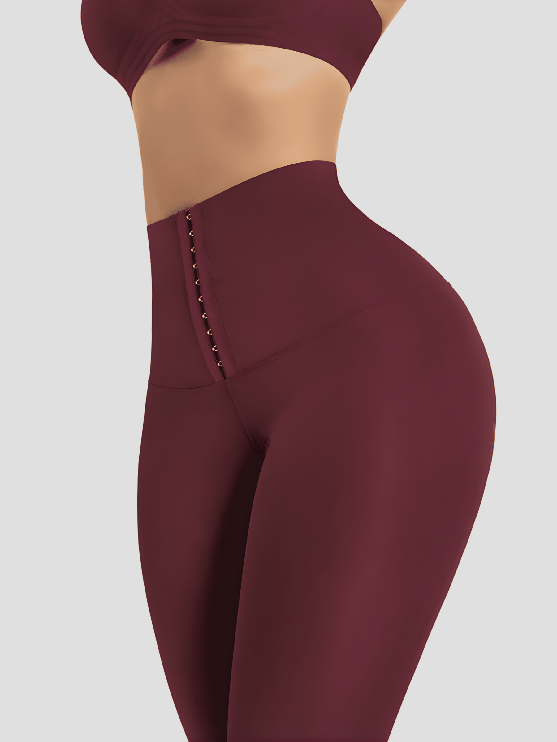 Woman posing wearing yellow waist training corset leggings by BodyFlexx Shapewear