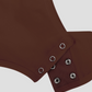 Close-up of the triple button crotch closure designed for bathroom convenience on a brown halter shapewear bodysuit.