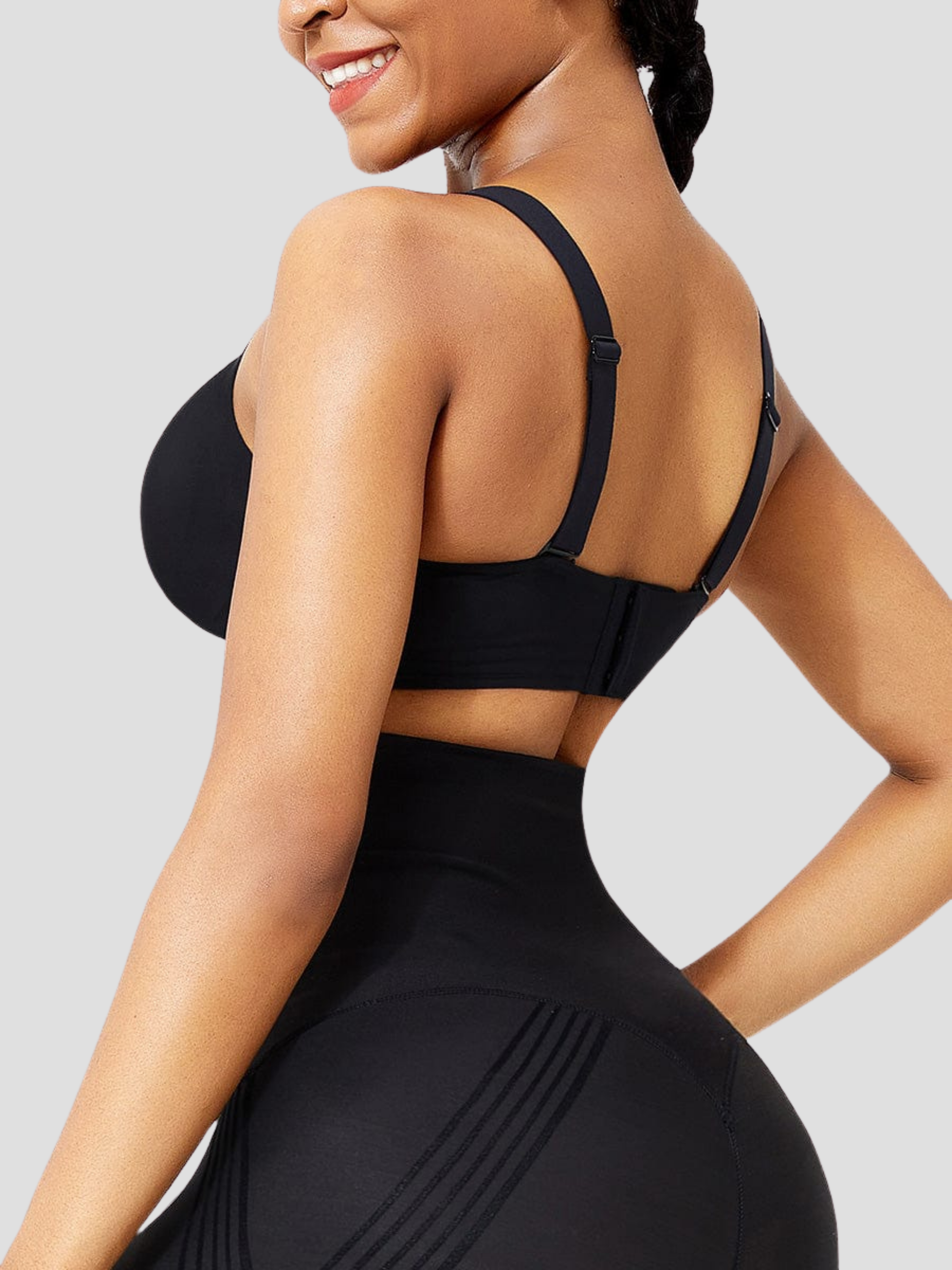 Woman wearing the black seamless and wireless padded t-shirt bra by BodyFlexx.