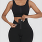 Woman wearing black waist training leggings with a corset closure designed for tummy-control and cellulite-smoothing by BodyFlexx Shapewear.