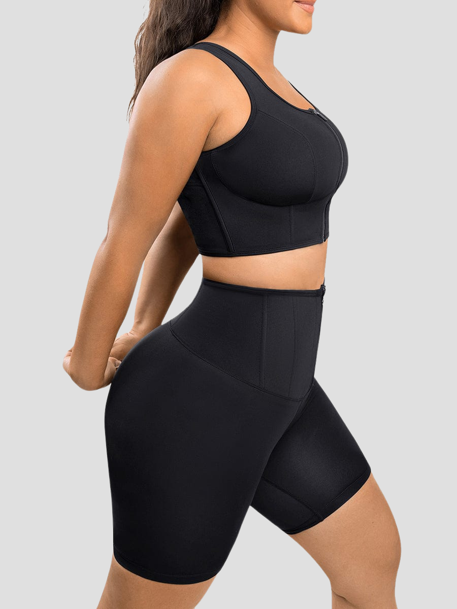 A woman stretching wearing a black sports bra top designed with removable padding flexible boning to ease pain and provide posture correction.