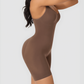 Curvy woman wearing a brown bodysuit shapewear garment designed by BodyFlexx.