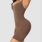 Woman wearing a good quality brown shapewear bodysuit flaunting her curves.