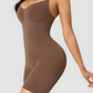 Curvy woman wearing a brown bodysuit shapewear garment.
