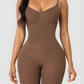 Model wearing a mid-thigh brown bodysuit shapewear garment.
