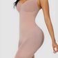 Woman wearing a skin colour mid-thigh full bodysuit shaper with an open crotch by BodyFlexx Shapewear.