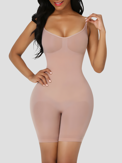 Woman wearing a nude colour mid-thigh bodysuit shaper with an open crotch by BodyFlexx Shapewear.