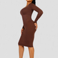 Woman posing in a brown long sleeve midi shapewear dress desinged by BodyFlexx.