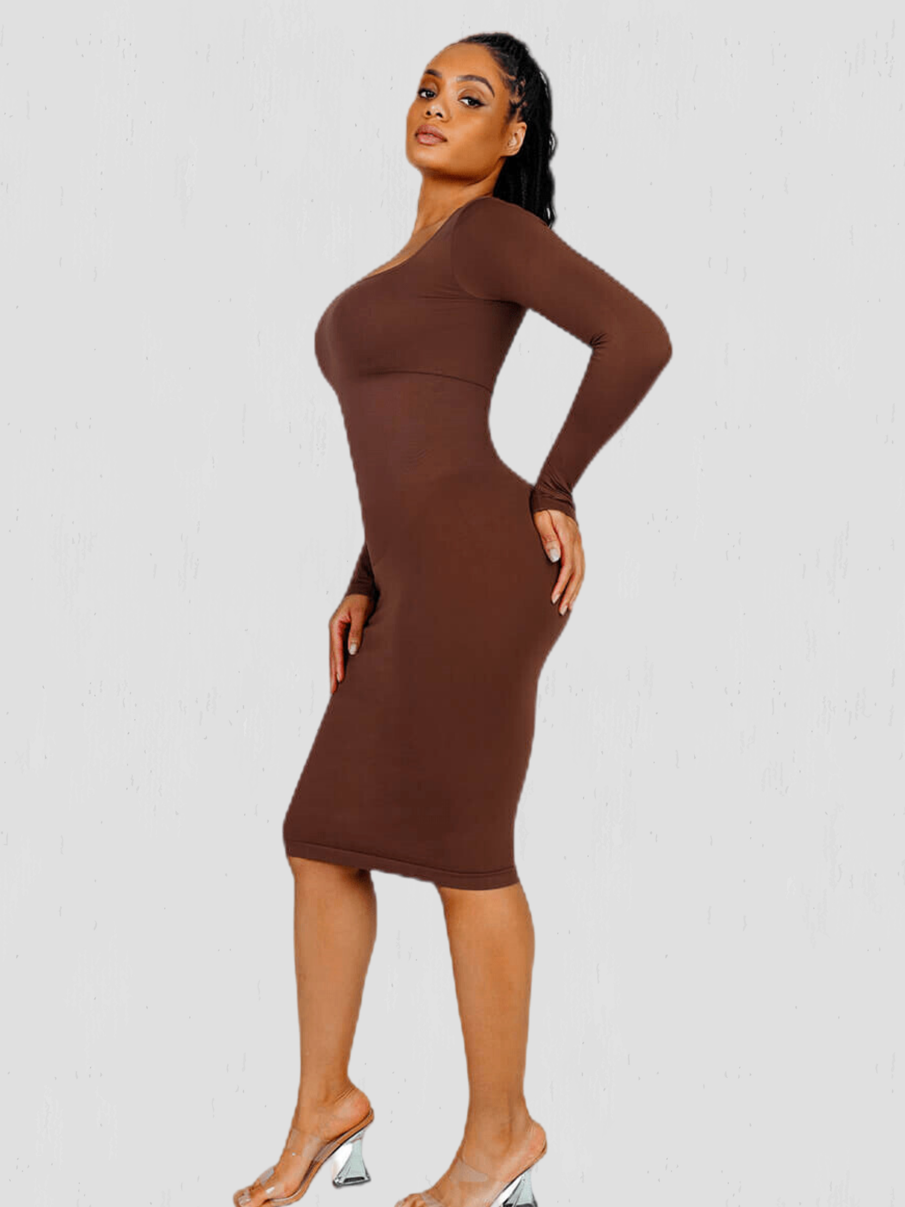 Woman posing in a brown long sleeve midi shapewear dress desinged by BodyFlexx.