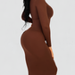 Woman wearing a long sleeve brown midi sculpting dress made by BodyFlexx Shapewear.