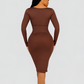Woman wearing a long sleeve brown midi shaping dress by BodyFlexx Shapewear.