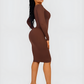 Woman wearing a long sleeve brown midi sculpting dress by BodyFlexx Shapewear.
