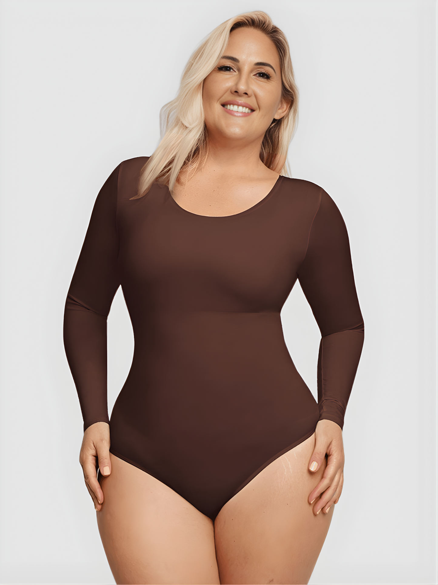 Woman wearing a brown long-sleeve shaping bodysuit by BodyFlexx Shapewear.