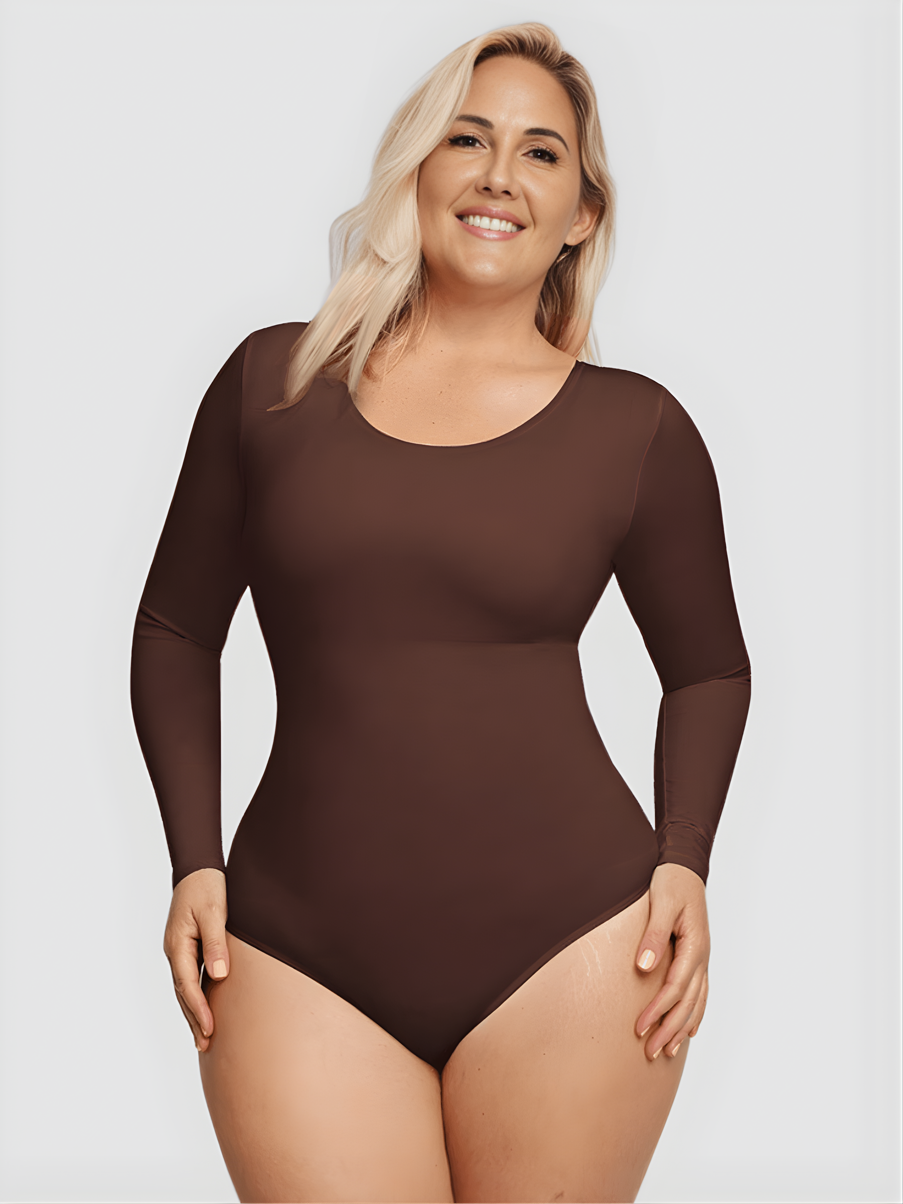 Woman wearing a brown long-sleeve shaping bodysuit by BodyFlexx Shapewear.
