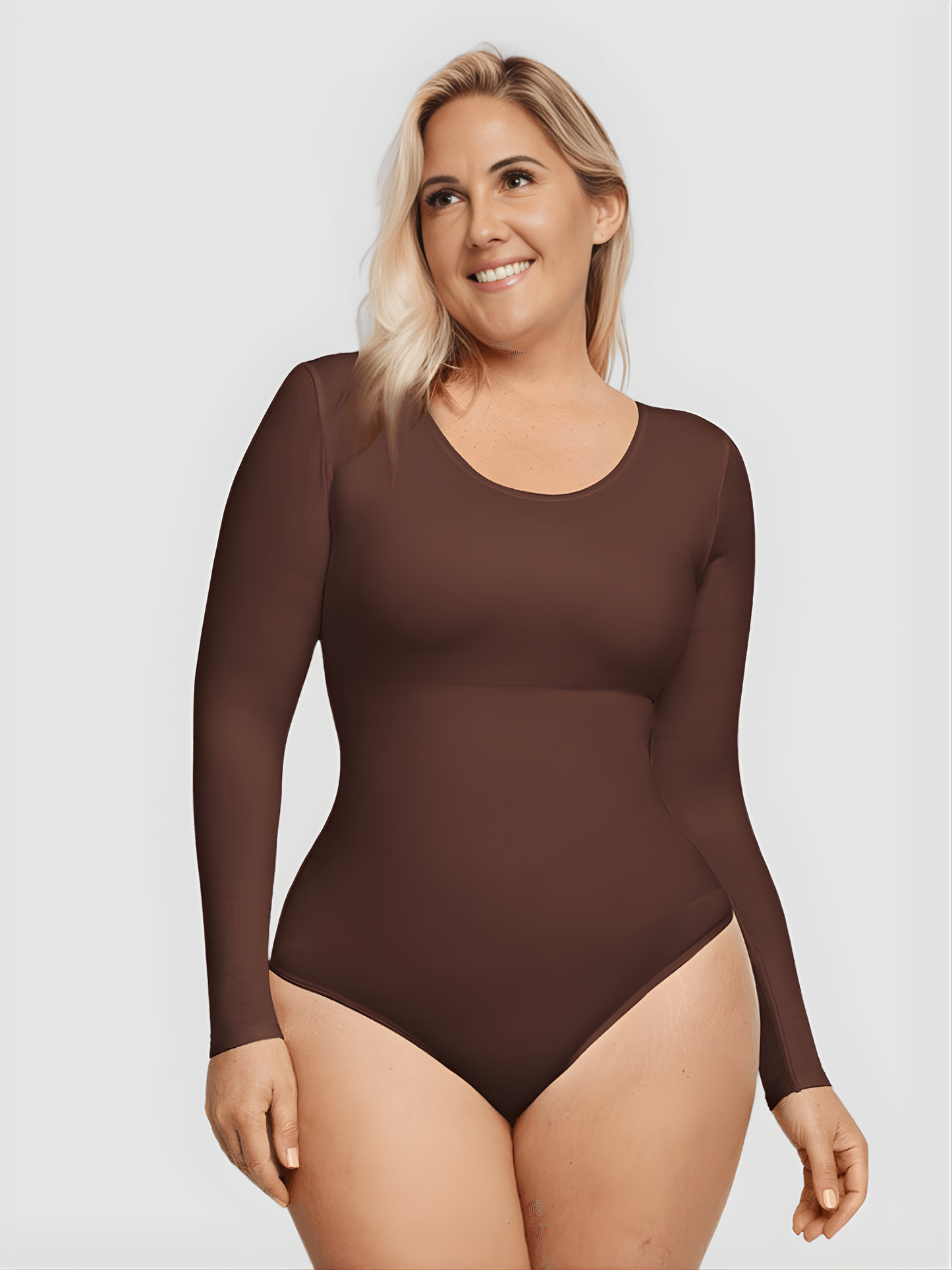 Woman wearing a brown long-sleeve shapewear bodysuit by BodyFlexx.
