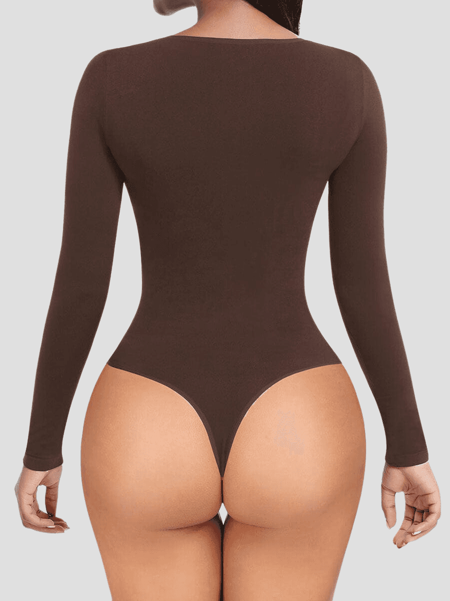 Woman wearing a brown long-sleeve shaping bodysuit showing the thong design.