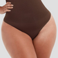 Close up of woman's waist wearing brown high-waisted shapewear underwear with body-contouring tummy and waist control.