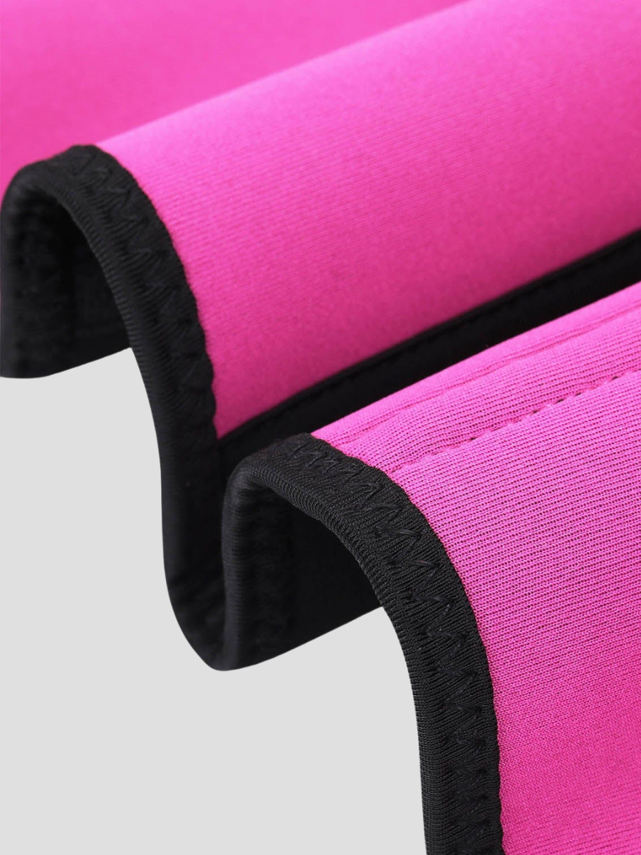 Close up view of the seams and stitching of pink a sauna activewear vest showing the the flexible boning designed for back support and tummy-control. 