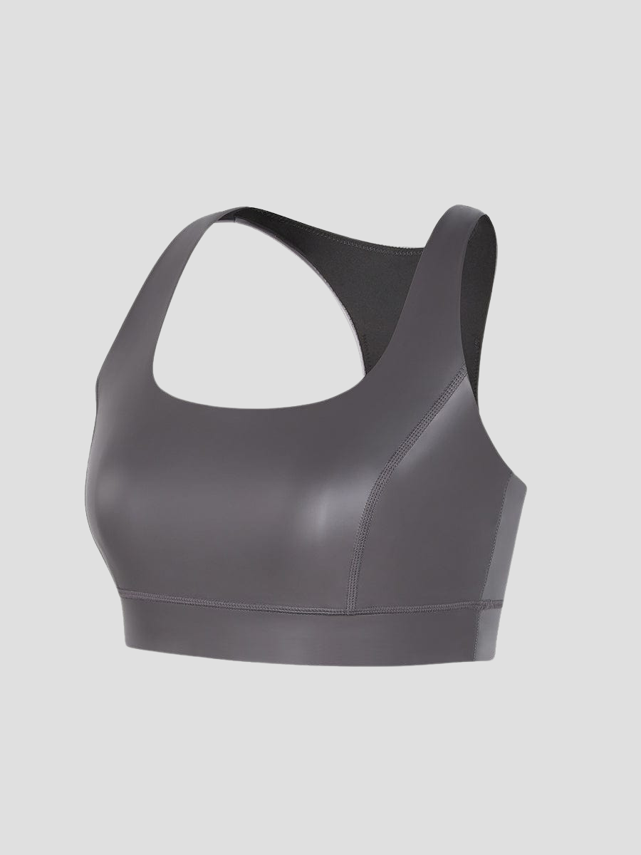 Close up of a silver metallic-like neoprene sauna sports bra by BodyFexx.