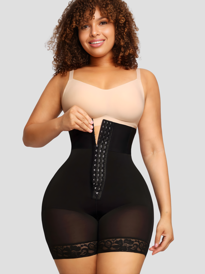 Woman smiling wearing a black Columbian faja corset shapewear garment with lace details.
