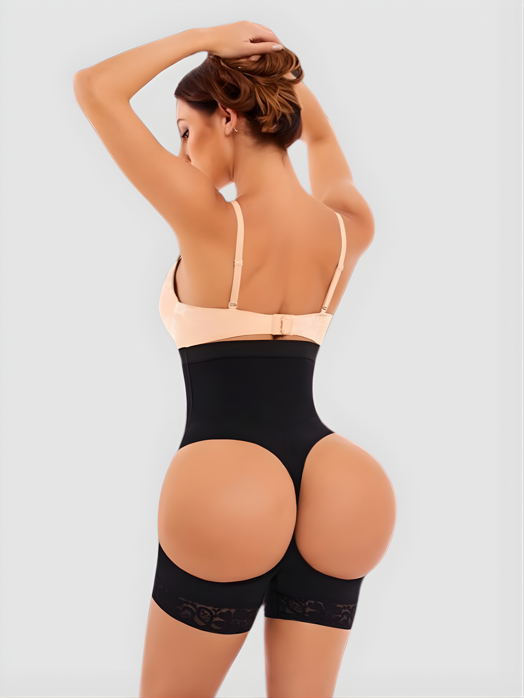 Woman in a black high-waisted Columbian faja with an open hip and bum designed by BodyFlexx Shapewear.