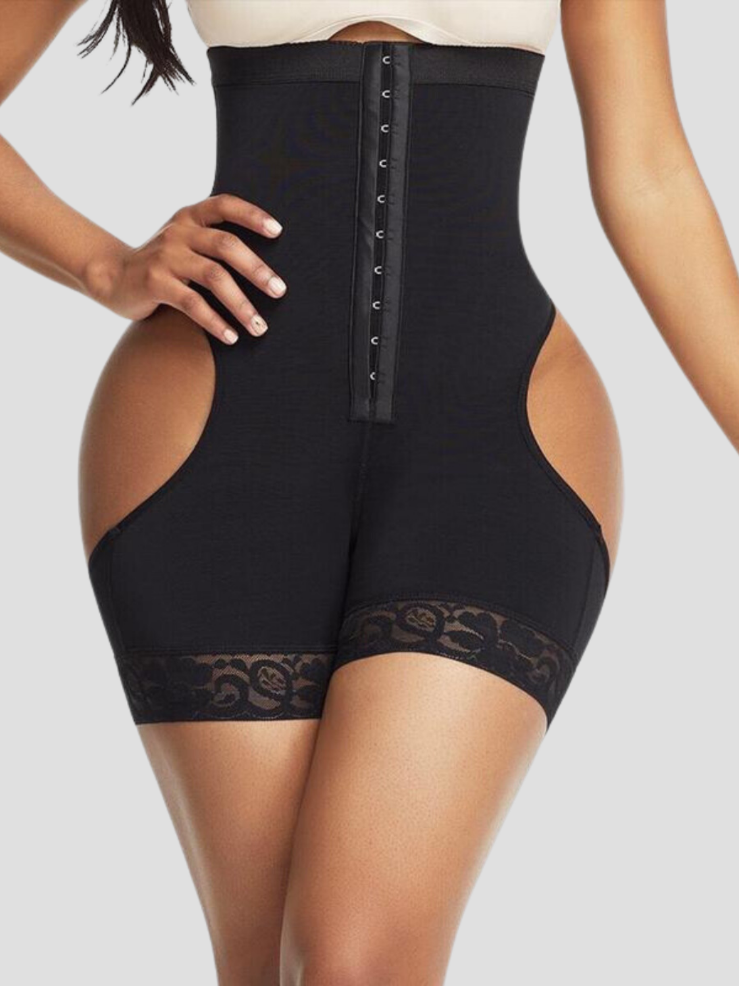Woman in a black high-waisted Columbian faja with an open hip and bum designed by BodyFlexx Shapewear.
