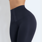 Close up of the a woman's waist wearing high waisted blue waist training leggings with a 3 row hook-and-eye corset closure by BodyFlexx Shapewear.