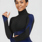 Woman wearing a blue and black zippered cropped activewear BBL jacket by designed by BodyFlexx.