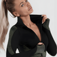 Fitness model in a green and black zippered cropped activewear BBL jacket  designed by BodyFlexx.