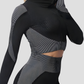 Woman wearing a black and gray color block activewear BBL jacket with a high zipper by BodyFlexx.