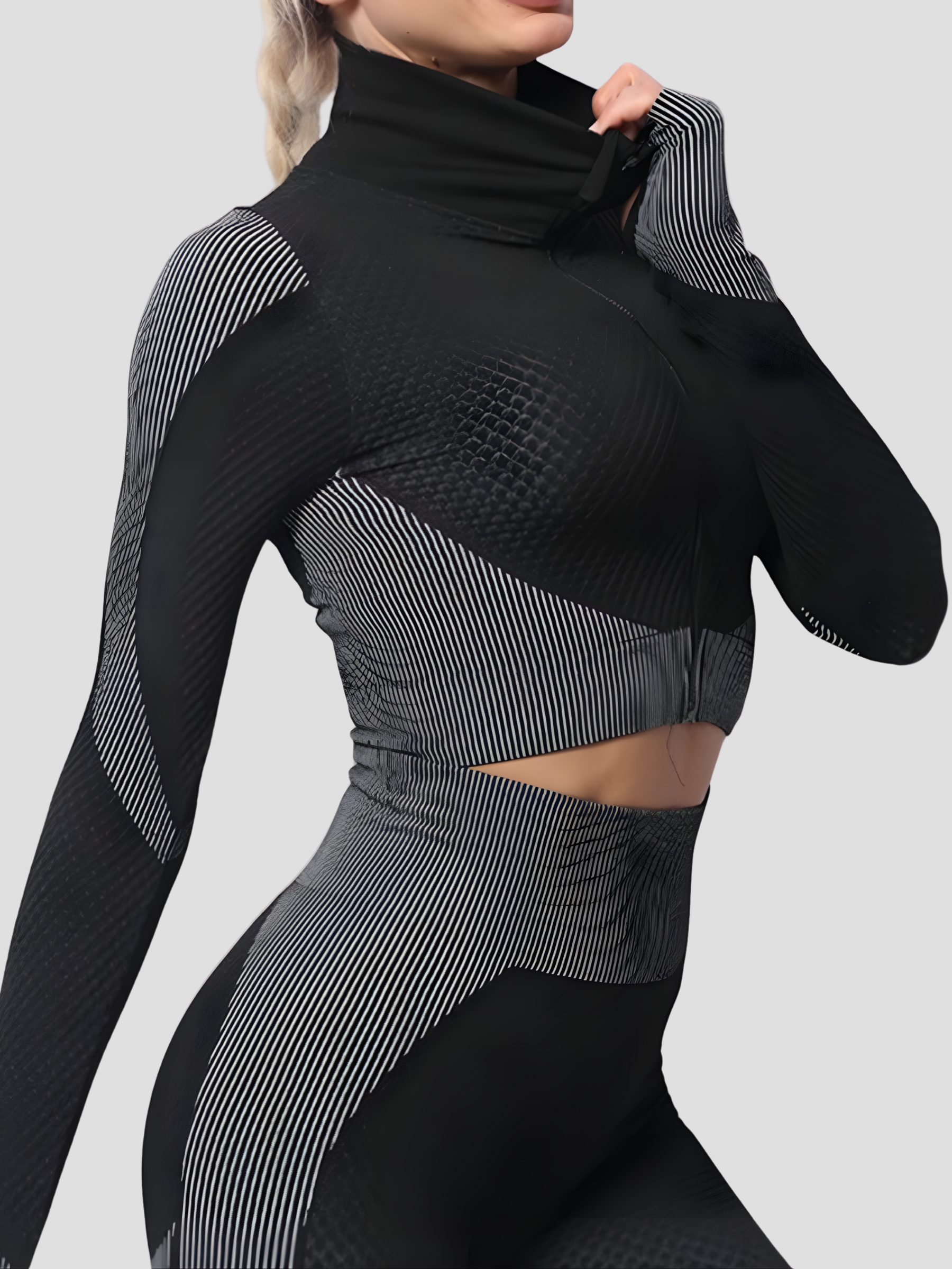 Woman wearing a black and gray color block activewear BBL jacket with a high zipper by BodyFlexx.