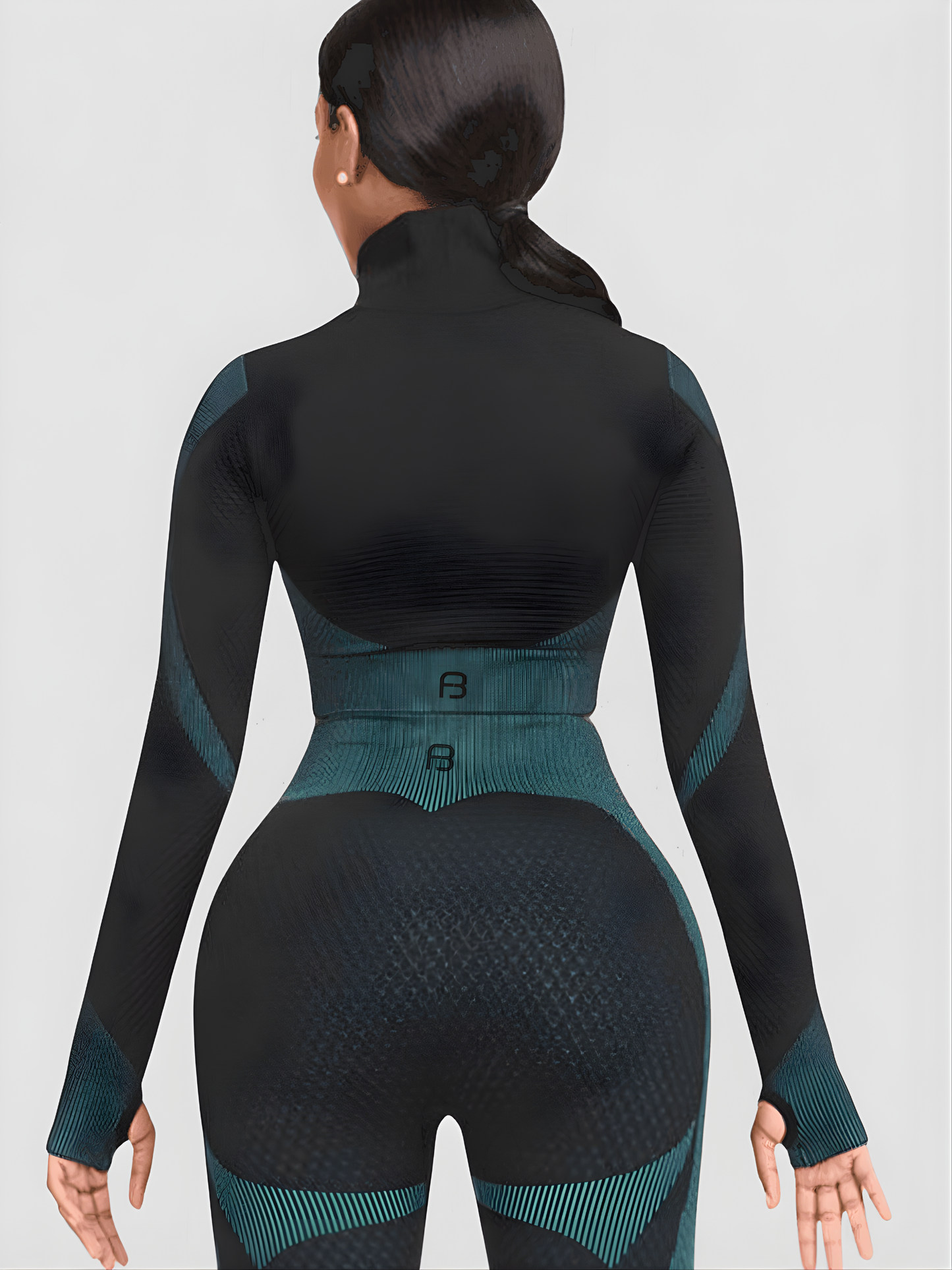 Woman wearing a teal and black zippered cropped activewear BBL jacket with matching leggings.by BodyFlexx
